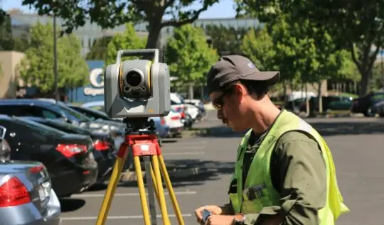 man standing facing theodo light