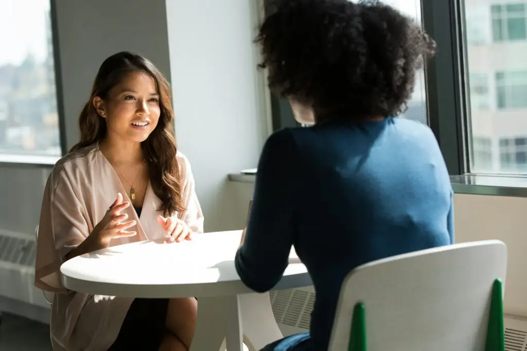 two women sitting on chair for negotiation