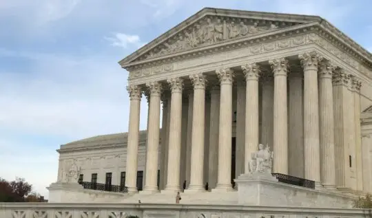 a large white building with columns and pillars