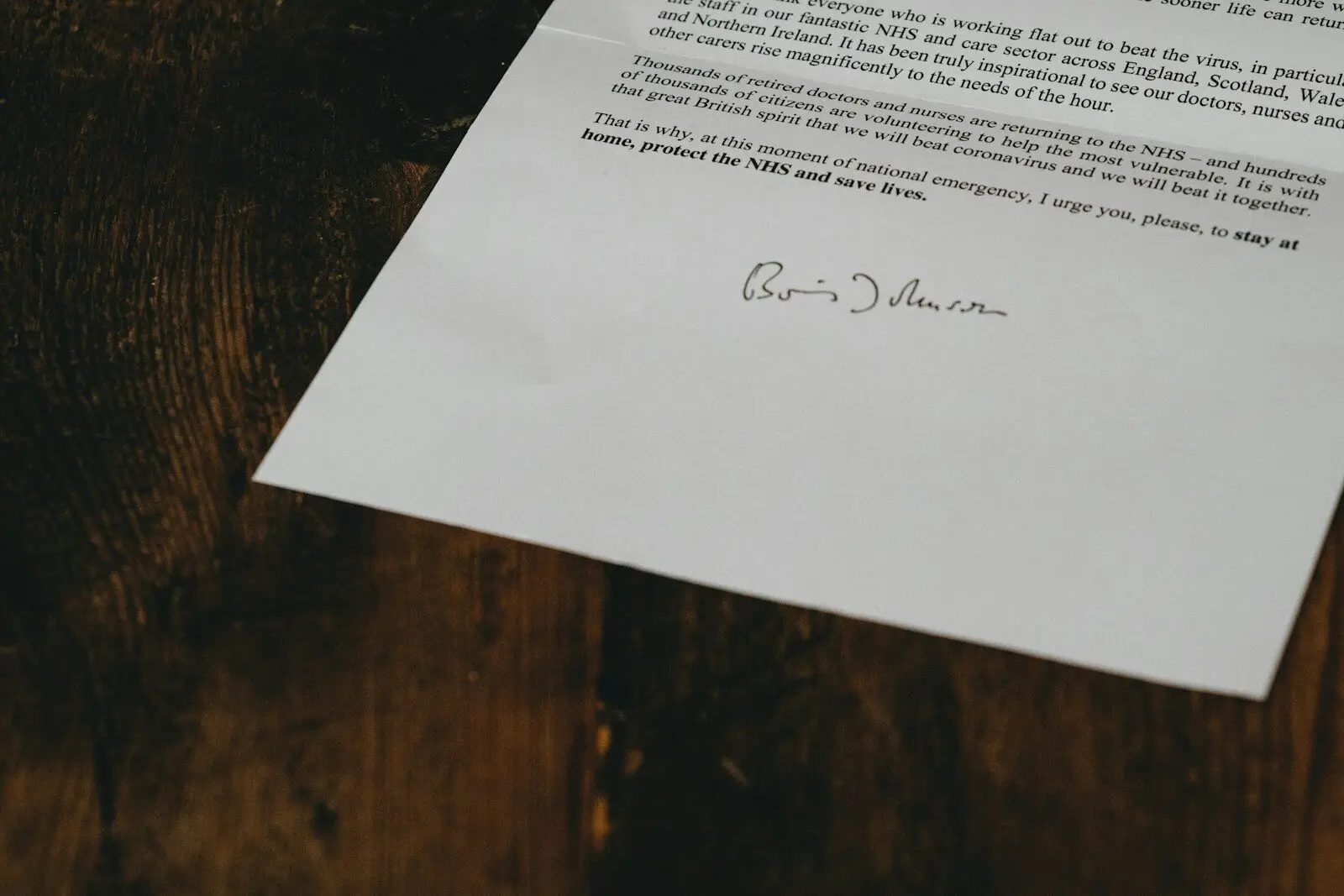 Photo by Annie Spratt - Daughtrey Law Firm white printer paper on brown wooden table