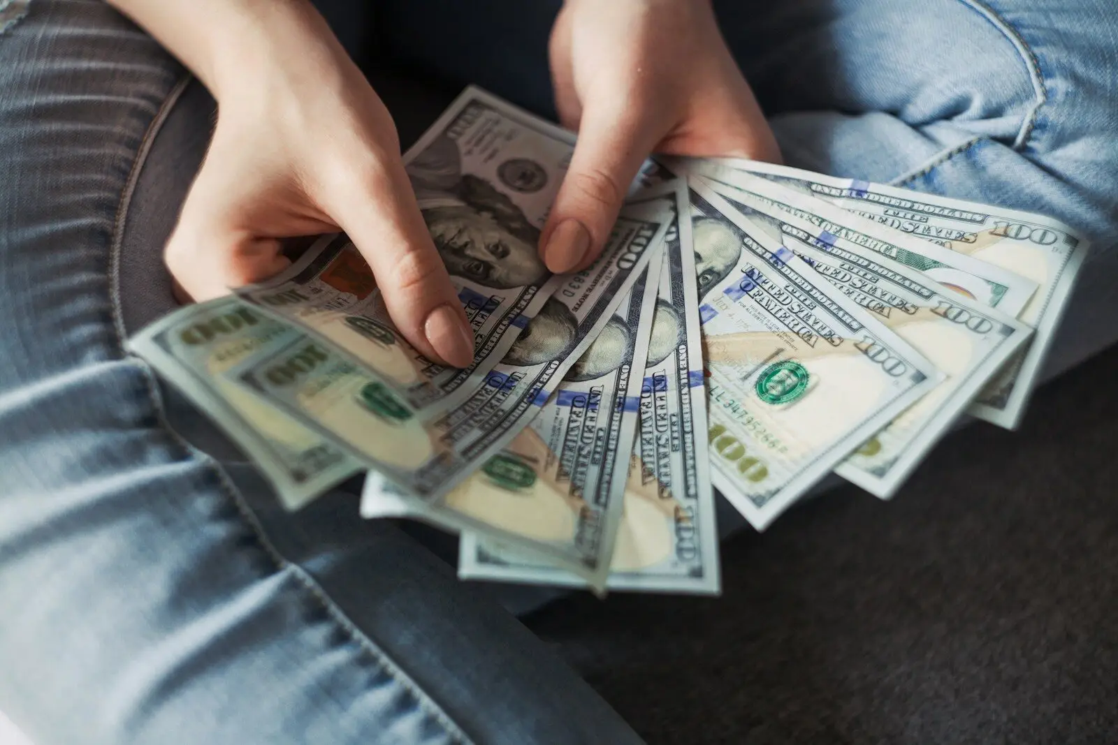 Photo by Alexander Mils - Daughtrey Law Firm fan of 100 U.S. dollar banknotes